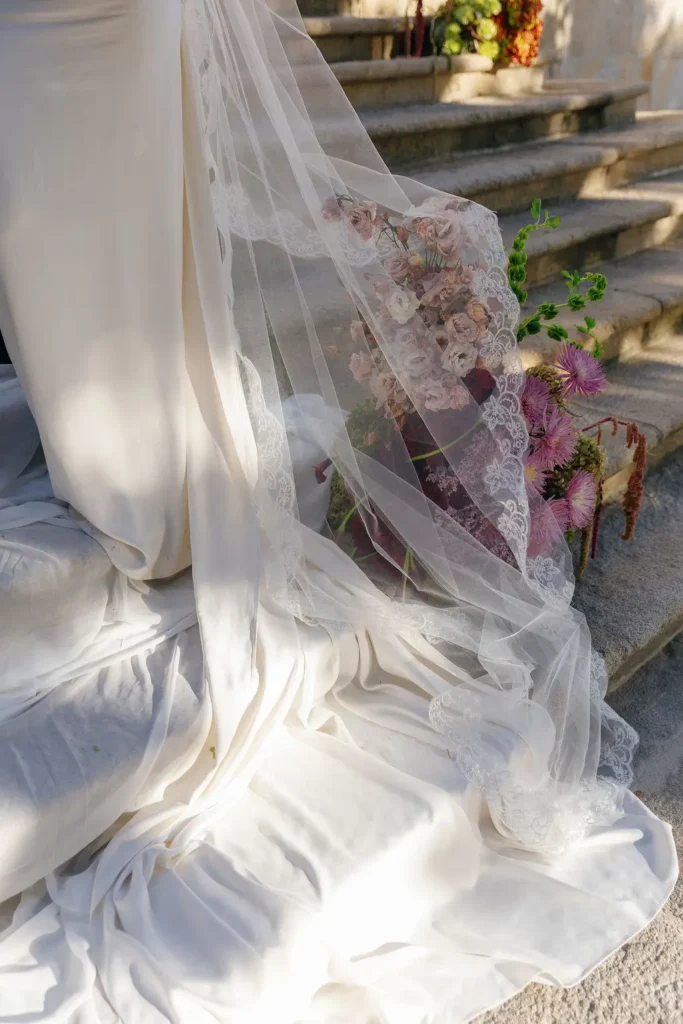 Bride holding a bespoke bouquet with dramatic dark florals